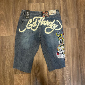 Ed Hardy denim jeggings with skull and crossbones design(cut at the bottom)